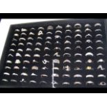 A hundred silver rings - various designs (tray not