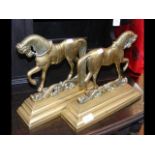 A pair of decorative brass "horse" doorstops - eac