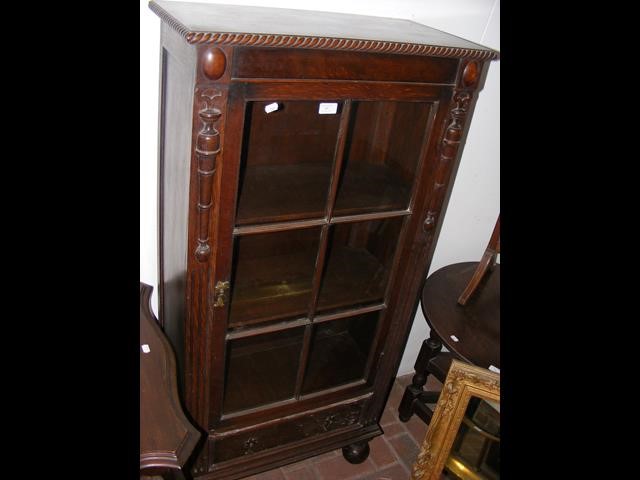 An oak display cabinet