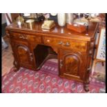 Antique desk with two drawers and cupboards below