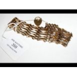 A lady's 9ct gold gate bracelet