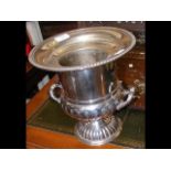 A 26cm high silver plated wine cooler