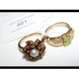 A lady's dress ring and one other