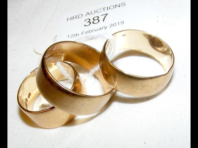 Three gold wedding bands