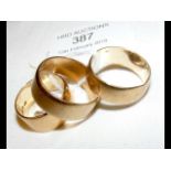 Three gold wedding bands