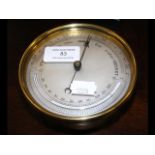 A 12cm diameter brass cased barometer