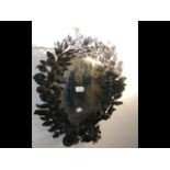 Decorative cast metal oval wall mirror - 56cm