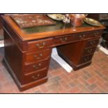 Antique pedestal desk with nine drawers to the fro