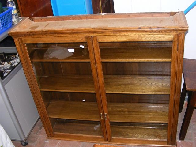 An oak two door display cabinet