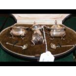 A silver condiment set by Mappin & Webb in present