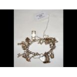 A silver charm bracelet with sixteen charms