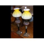 A pair of Victorian Corinthian column oil lamps wi