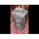 A pierced cast metal Veritas stove - 64cm high