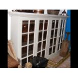 A large old painted pine four door bookcase - 232cm
