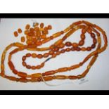 Three amber necklaces, together with loose beads - appro