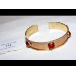 A lady's elegant bangle with inset stones