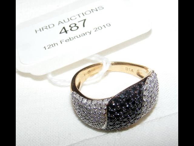 A 9ct gold black and white diamond ring