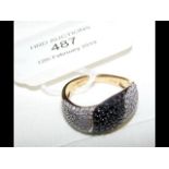A 9ct gold black and white diamond ring