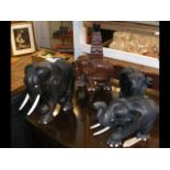 A carved ebony Elephant, together with two others