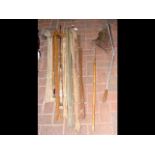 Selection of old fishing rods, net, etc.