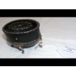 An oval silver inlaid trinket box on cabriole supports