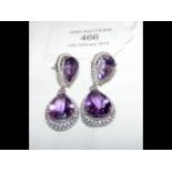 A pair of amethyst double drop earrings