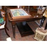 A mahogany extending dining table with two leaves