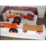 A large Ertl Case 970 Tractor with Plow, together