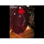 A red glass charger - 55cm