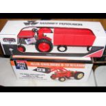 A die-cast Massey Ferguson with trailer, together