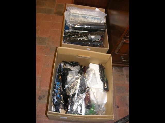 Two boxes containing train parts