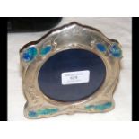 A silver and enamel photo frame - 15.5cm high