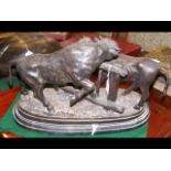 A bronzed style cattle figural group on marble pli