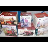 Six boxed die-cast tractors with figures, etc.