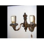 A cast bronzed two branch wall light