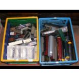 Selection of train parts in two plastic containers