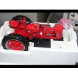 A Franklin Mint Precision Model tractor in original box and one other