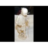A Chinese sectional carved ivory figure - 13.5cm high