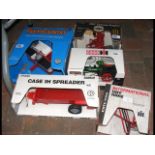 Five boxed die-cast model pieces of farm equipment