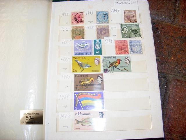 Nine albums of collectable stamps, including Cayma