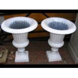 A pair of white painted cast iron classical style