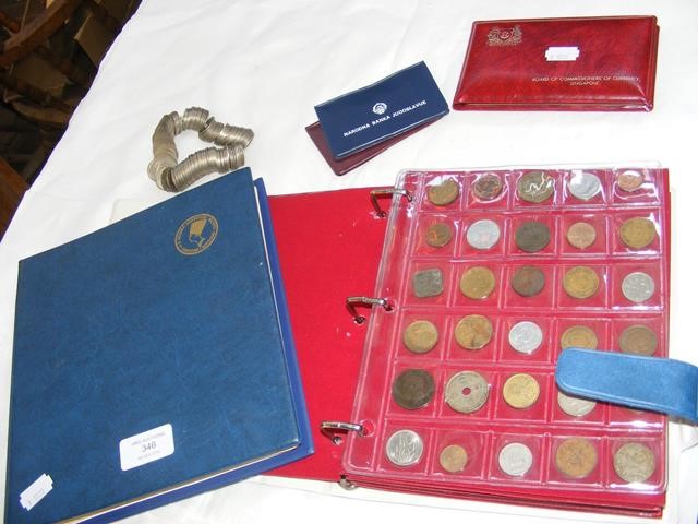 Two albums of world coins and three World Coin Set