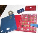 Two albums of world coins and three World Coin Set