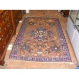 A Middle Eastern style rug with central medallion