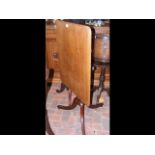 A 19th century mahogany rectangular tilt-top table