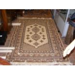 A Middle Eastern style rug - 215cm x 140cm