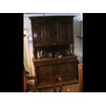 An early 20th century French walnut carved buffet