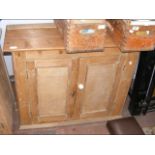 A pine cupboard enclosed by a pair of doors - widt