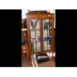 An Edwardian two door display cabinet