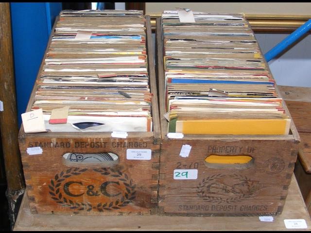 Two vintage bottle crates containing 45 rpm record